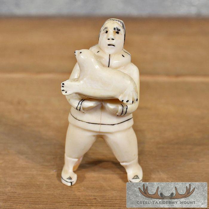 Ivory Eskimo & Seal Figurine For Sale